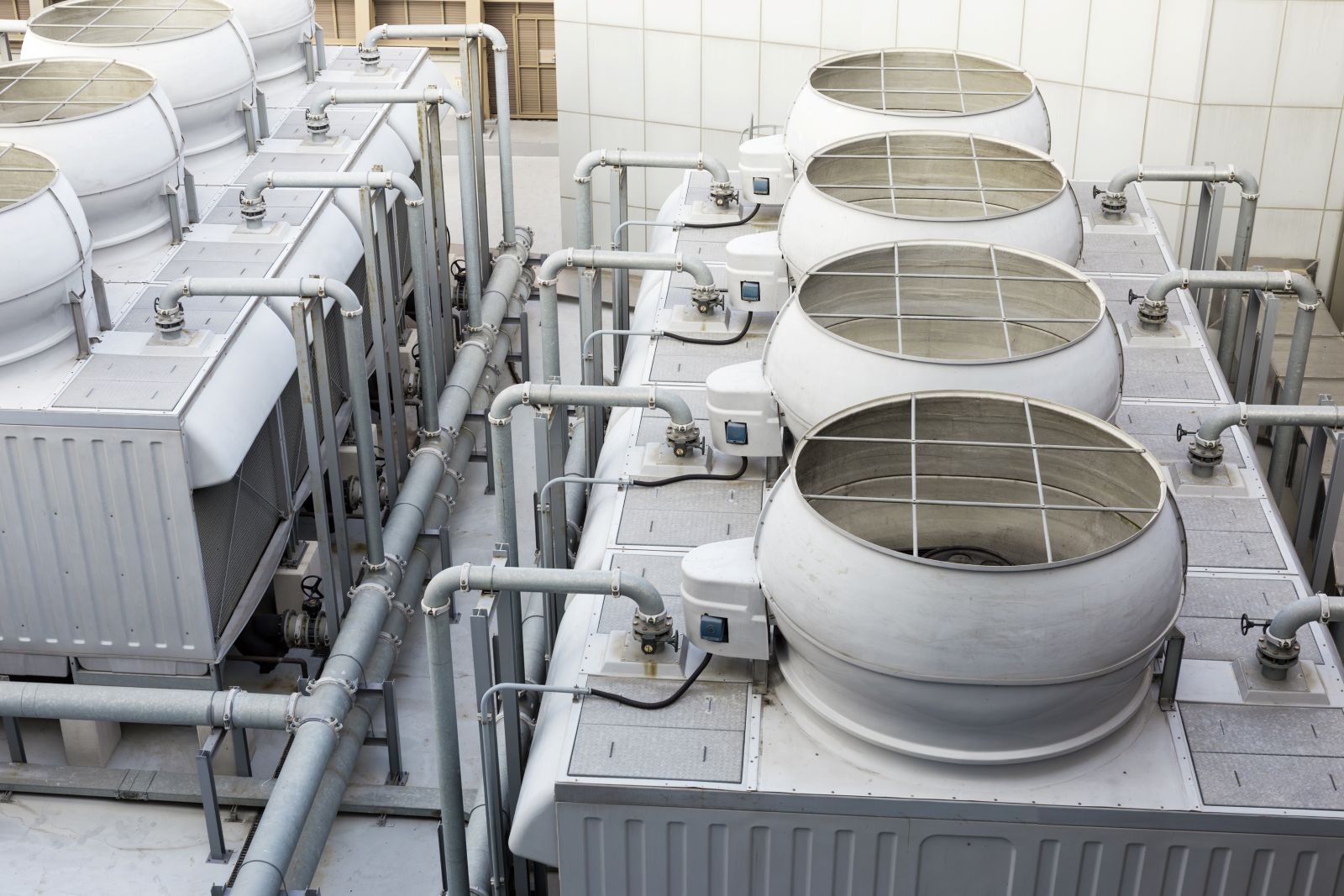 Commercial cooling tower array and treatment piping